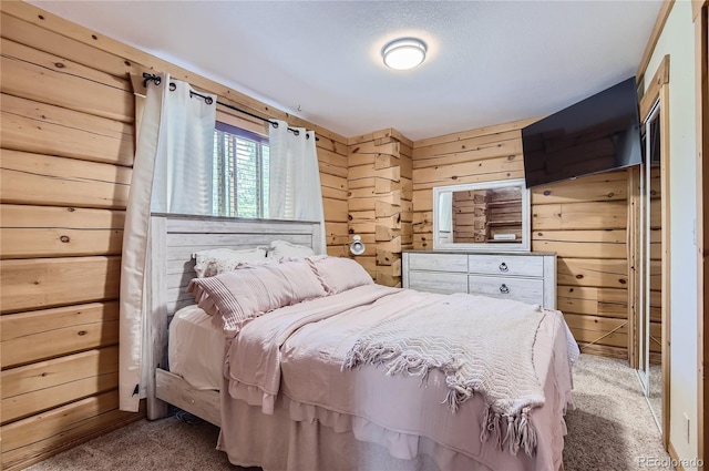 bedroom with carpet and wood walls