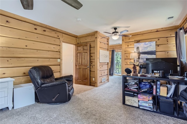 carpeted home office with log walls