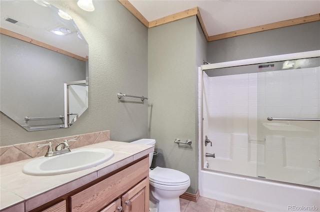 full bathroom featuring toilet, vanity, and shower / bath combination with glass door