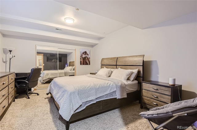 bedroom featuring light colored carpet