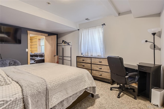 bedroom featuring carpet and beam ceiling