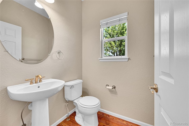 16500 Hitching Post Cir, Parker, CO 80134 - half bath featuring wood finished floors and toilet