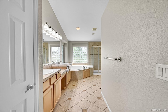 16500 Hitching Post Cir, Parker, CO 80134 - bathroom featuring a textured wall, a stall shower, vanity, a bath, and tile patterned floors