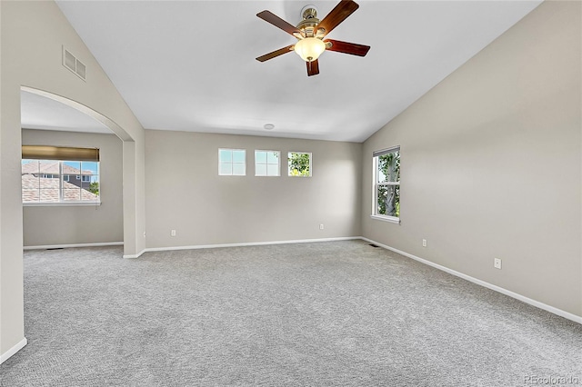 16500 Hitching Post Cir, Parker, CO 80134 - carpeted empty room with vaulted ceiling, healthy amount of natural light, a ceiling fan, and arched walkways