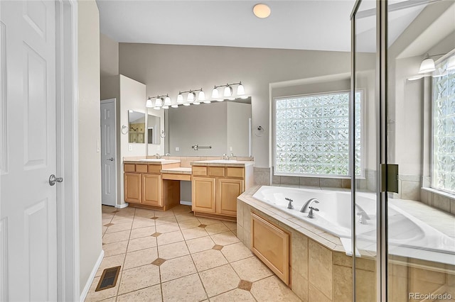 16500 Hitching Post Cir, Parker, CO 80134 - full bath featuring double vanity, a bath, tile patterned floors, and lofted ceiling