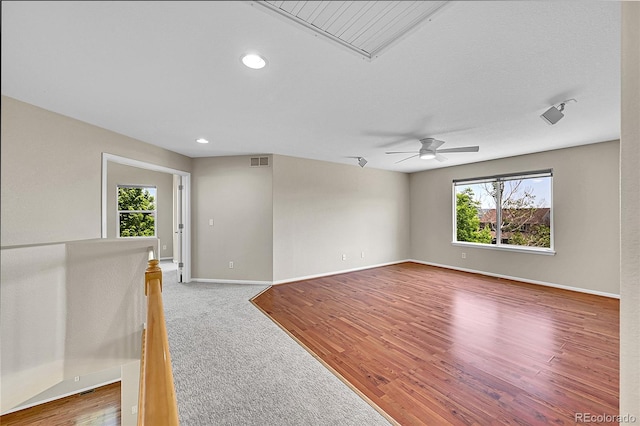 16500 Hitching Post Cir, Parker, CO 80134 - empty room featuring healthy amount of natural light, attic access, ceiling fan, recessed lighting, and wood finished floors