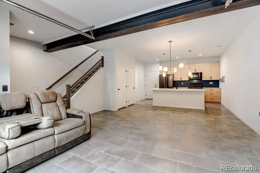 living room with beamed ceiling