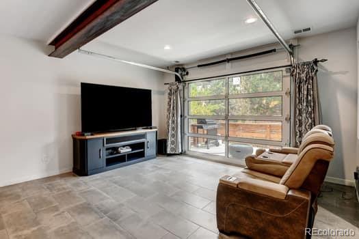 living room with beam ceiling