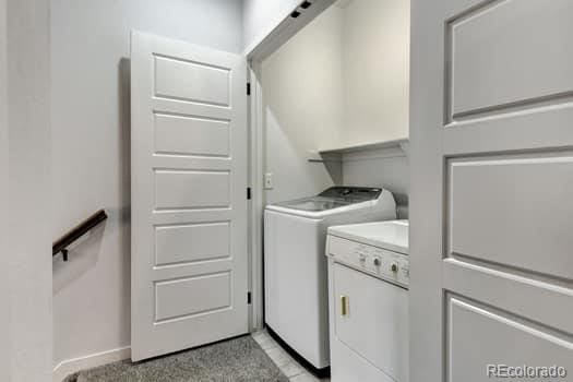 washroom with separate washer and dryer