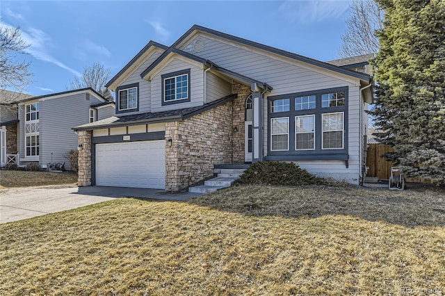 view of front of house featuring stone siding, fence, concrete driveway, a front yard, and an attached garage