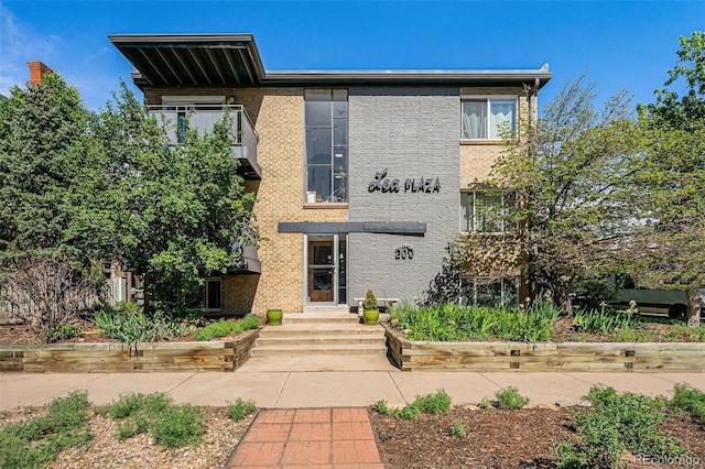 view of front of home with brick siding