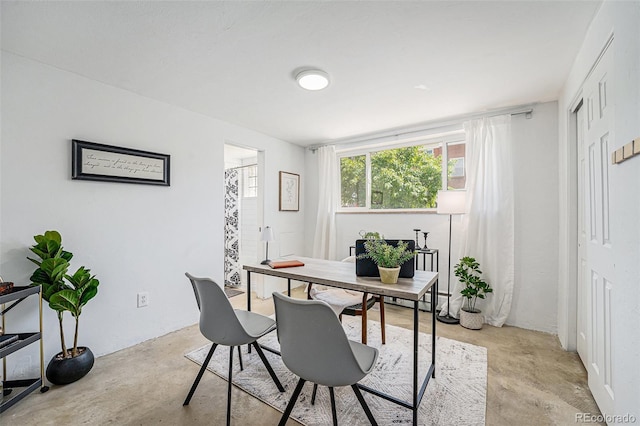 office area with concrete floors