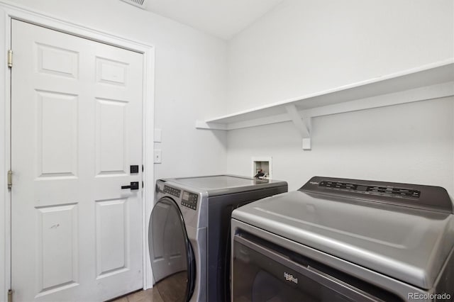 washroom with washer and dryer and laundry area