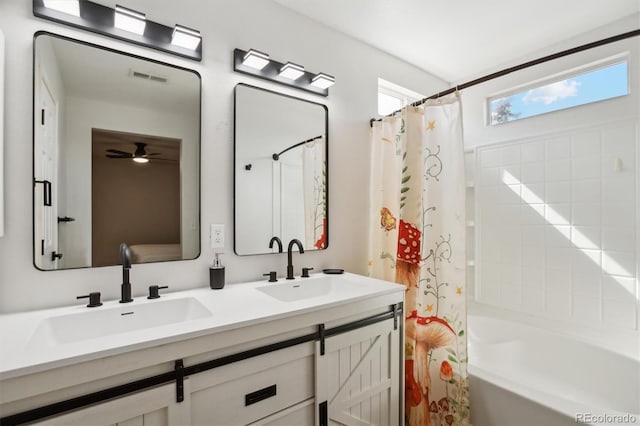 bathroom featuring a sink, visible vents, double vanity, and shower / bath combination with curtain