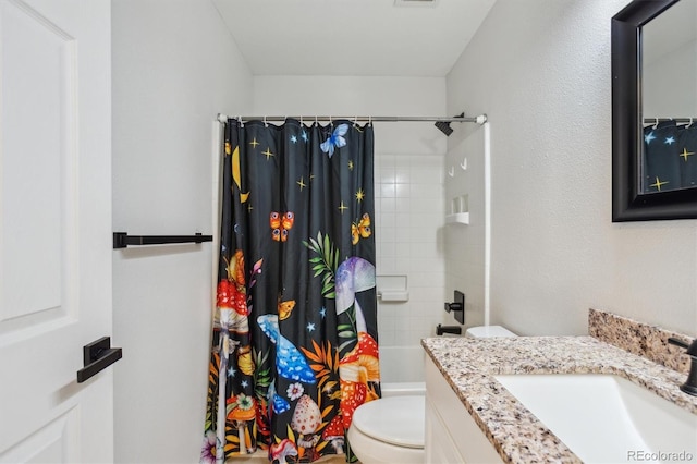 bathroom featuring visible vents, toilet, and vanity