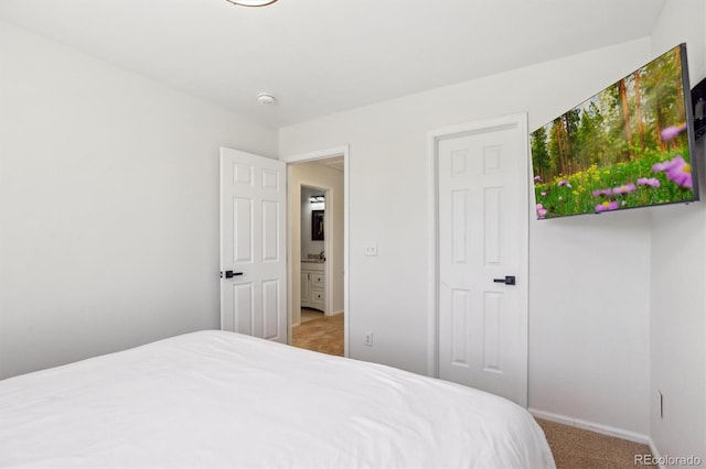 bedroom featuring carpet flooring and baseboards