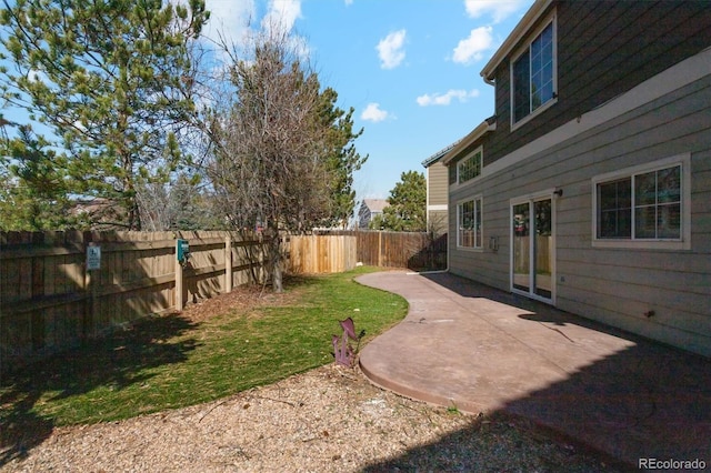 view of yard featuring a patio area and a fenced backyard