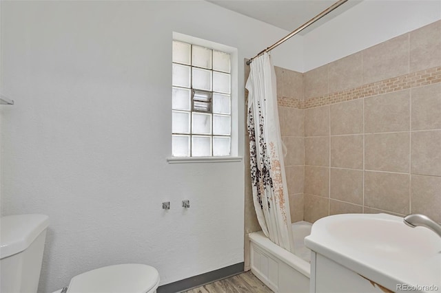 2955 N Gilpin St, Denver, CO 80205 - bathroom with toilet, wood finished floors, shower / tub combo, baseboards, and a sink