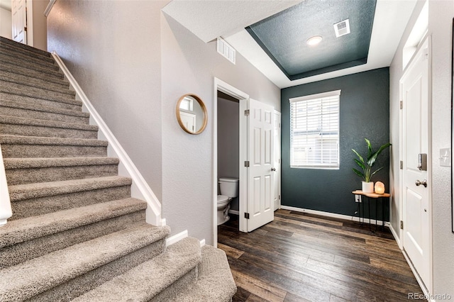 foyer with dark hardwood / wood-style floors