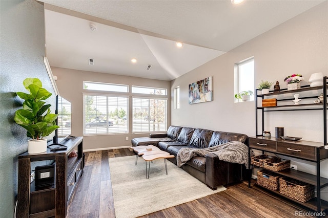 living room with dark wood-type flooring and lofted ceiling