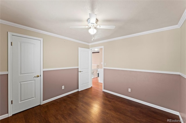 unfurnished bedroom with a ceiling fan, crown molding, baseboards, and dark wood-style flooring