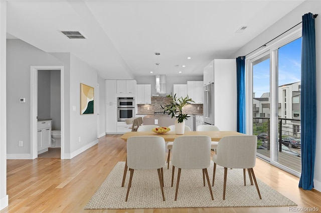 1284 Tennyson St Unit 1, Denver, CO 80204 - dining room featuring light wood-style flooring and recessed lighting