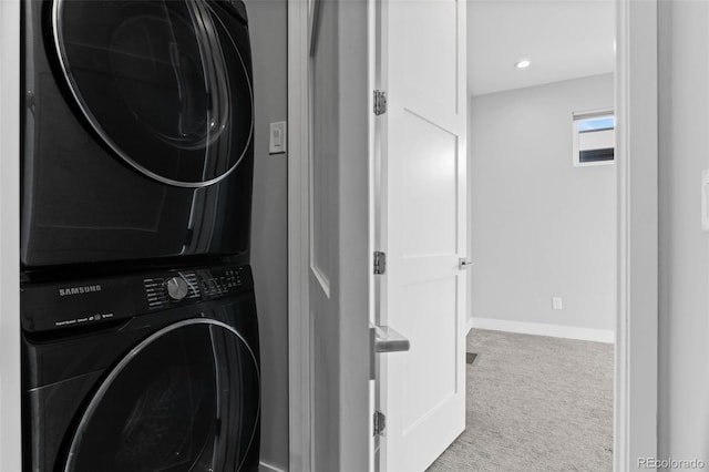 1284 Tennyson St Unit 1, Denver, CO 80204 - laundry room featuring stacked washer and clothes dryer, carpet flooring, and recessed lighting