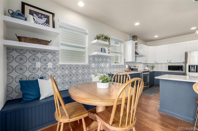 dining area with dark hardwood / wood-style floors