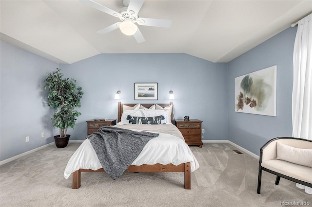 carpeted bedroom featuring ceiling fan and vaulted ceiling