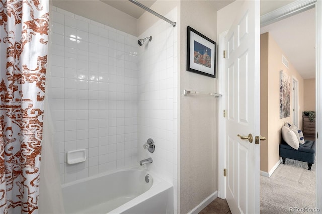 bathroom with shower / bath combination with curtain