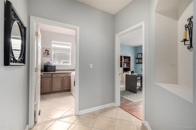 hallway with light tile patterned flooring