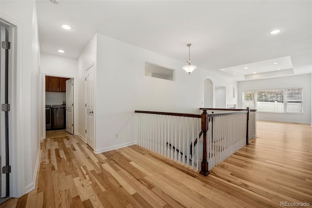 4400 S Ensenada St, Aurora, CO 80015 - hallway featuring light wood-style flooring, an upstairs landing, recessed lighting, baseboards, and arched walkways