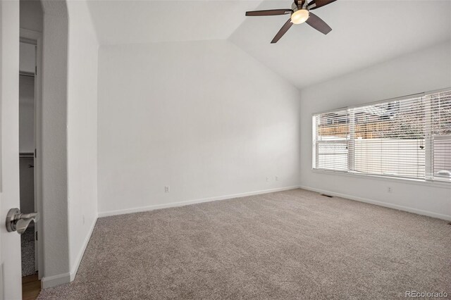 4400 S Ensenada St, Aurora, CO 80015 - spare room with ceiling fan, vaulted ceiling, carpet floors, and baseboards