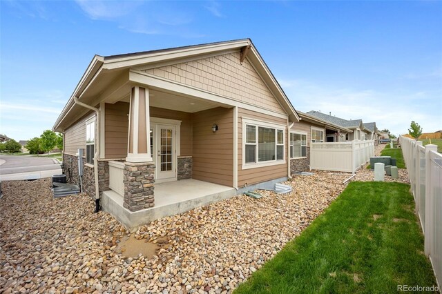 4400 S Ensenada St, Aurora, CO 80015 - back of property featuring stone siding