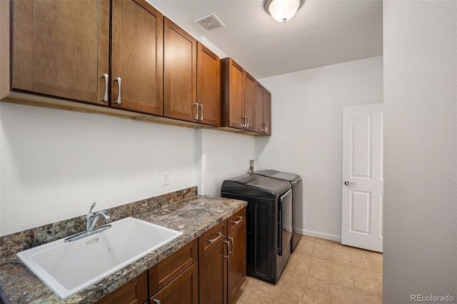 4400 S Ensenada St, Aurora, CO 80015 - laundry area with washer and clothes dryer, cabinet space, and baseboards