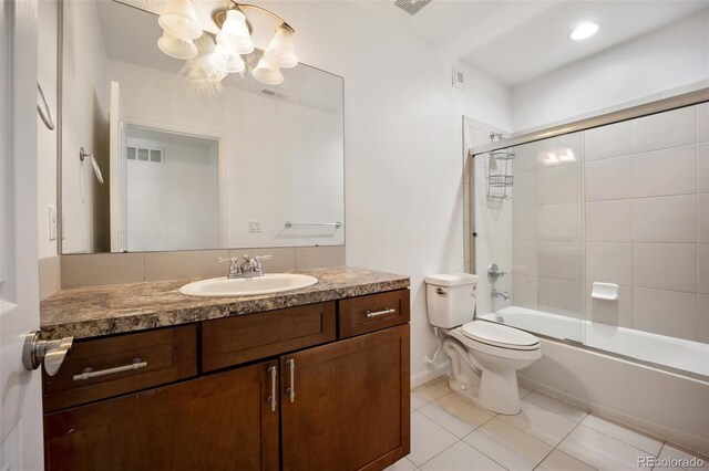 4400 S Ensenada St, Aurora, CO 80015 - bathroom featuring vanity, a chandelier, tile patterned flooring, toilet, and combined bath / shower with glass door