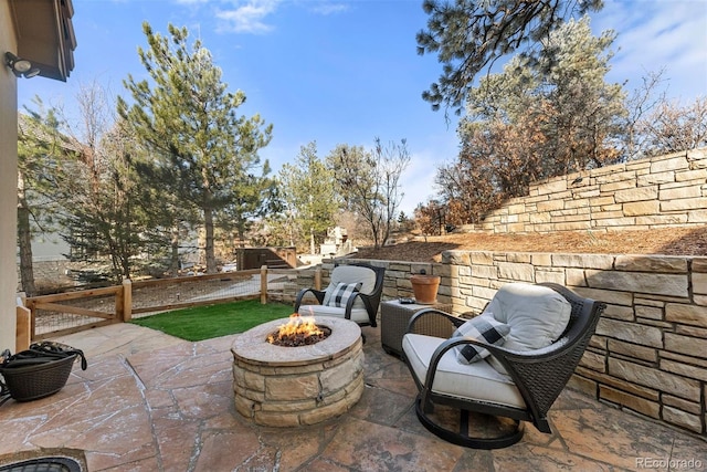 view of patio / terrace with an outdoor fire pit