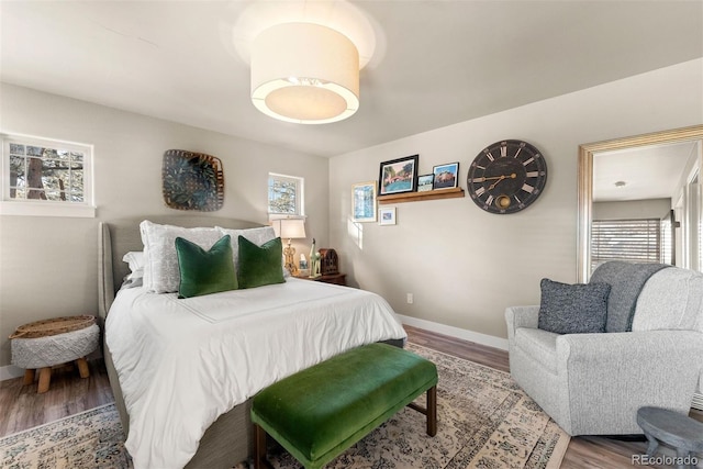 bedroom with hardwood / wood-style flooring