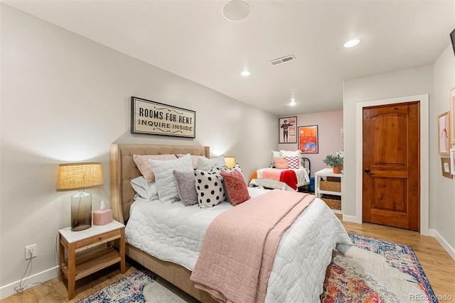 bedroom with light hardwood / wood-style floors