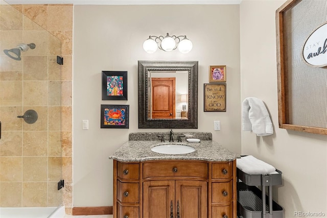 bathroom with walk in shower and vanity