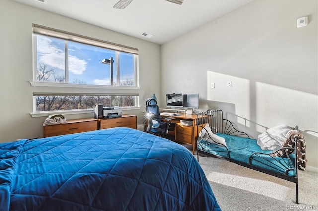 bedroom with visible vents and carpet