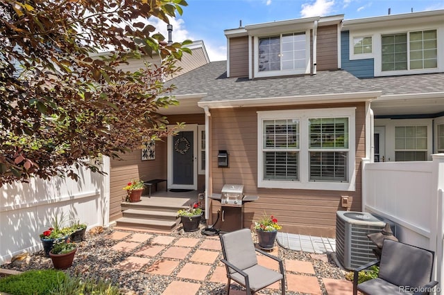 2528 Concord Cir, Lafayette, CO 80026 - entrance to property with roof with shingles and a patio area
