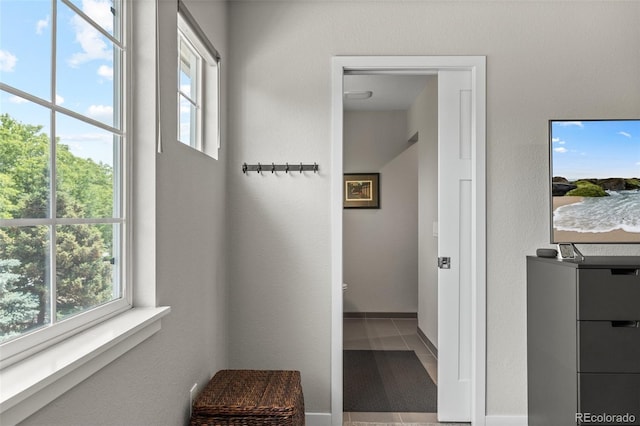 2528 Concord Cir, Lafayette, CO 80026 - corridor featuring plenty of natural light and tile patterned flooring