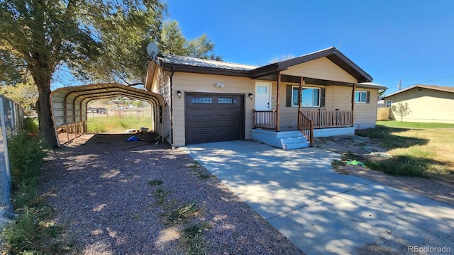 single story home featuring a front lawn, a carport, a porch, and a garage