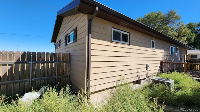 view of home's exterior with central AC