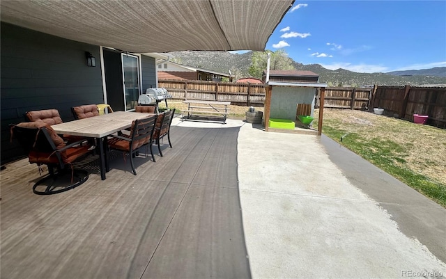98 Baylor Dr, Buena Vista, CO 81211 - fenced backyard with a mountain view, outdoor dining area, and a patio