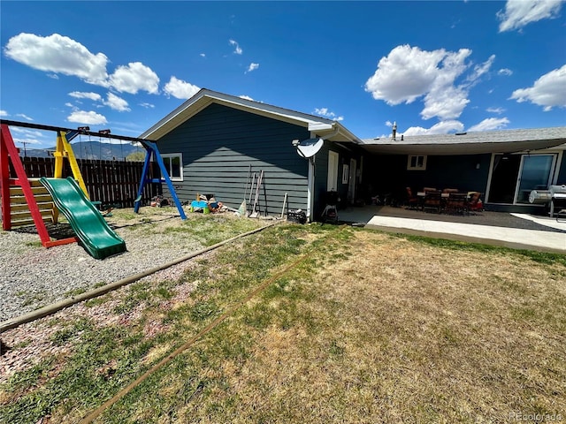 98 Baylor Dr, Buena Vista, CO 81211 - back of house with a playground and a patio area