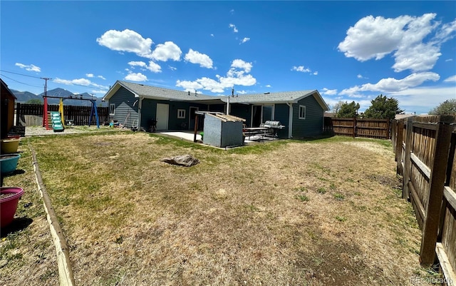 98 Baylor Dr, Buena Vista, CO 81211 - back of house with a patio and a playground