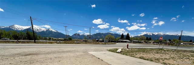 98 Baylor Dr, Buena Vista, CO 81211 - view of asphalt street with a mountain view and traffic signs