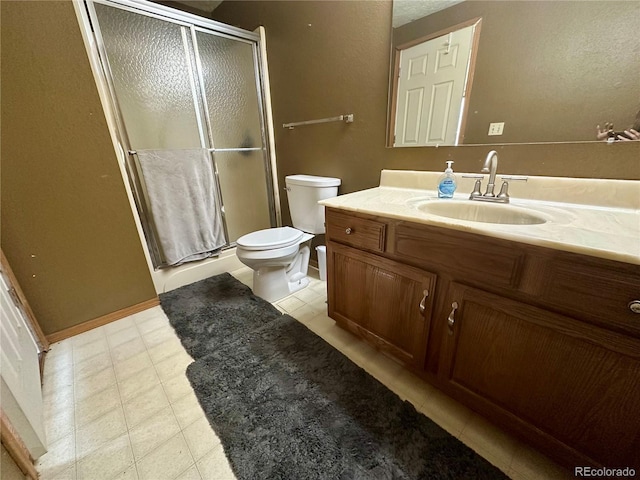 98 Baylor Dr, Buena Vista, CO 81211 - bathroom featuring toilet, vanity, and a shower stall